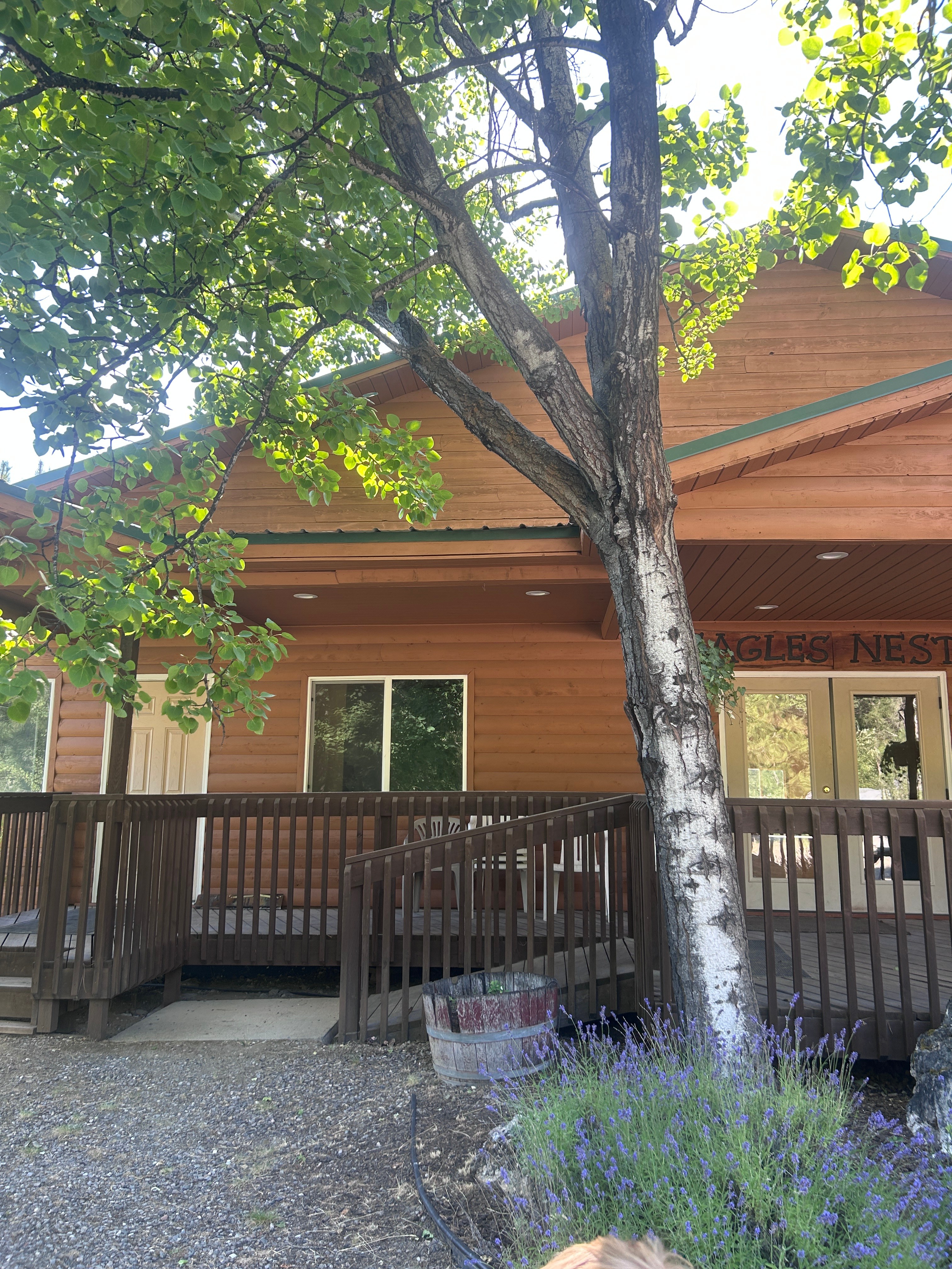 Eagles Nest Event Center exterior with log construction and wooden deck